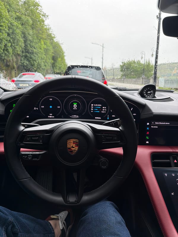 Porsche driver documents rainy morning traffic in Tbilisi