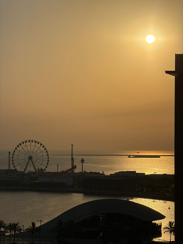 Urban waterfront sunset from ground and aerial perspective