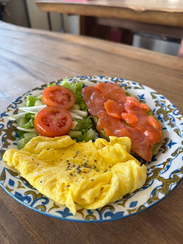 Morning meal documented on wooden table in Kuta