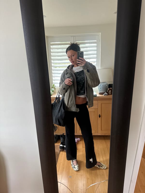 Woman takes mirror selfies at home in Wealden