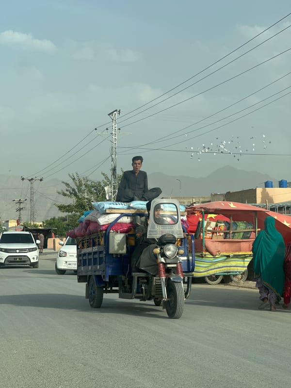 Commercial three-wheeler transports goods through Quetta streets