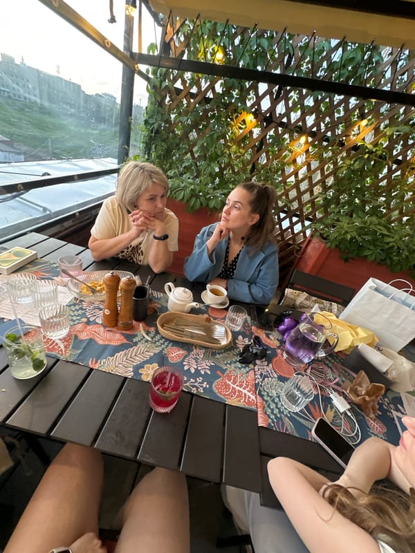 Diners enjoy drinks at outdoor restaurant terrace in Perm