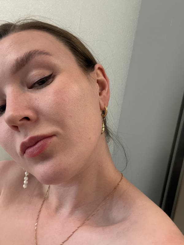 Woman takes selfies with kitten in sunny Izhevsk apartment