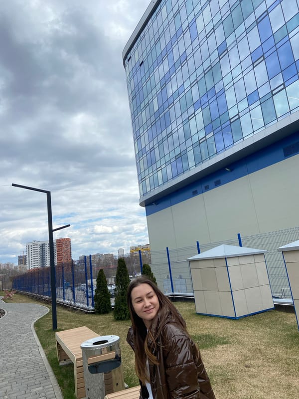 Woman poses with golden object in Izhevsk morning photo