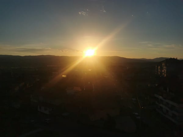 Sunset observed over Blagoevgrad, Bulgaria behind mountain silhouettes