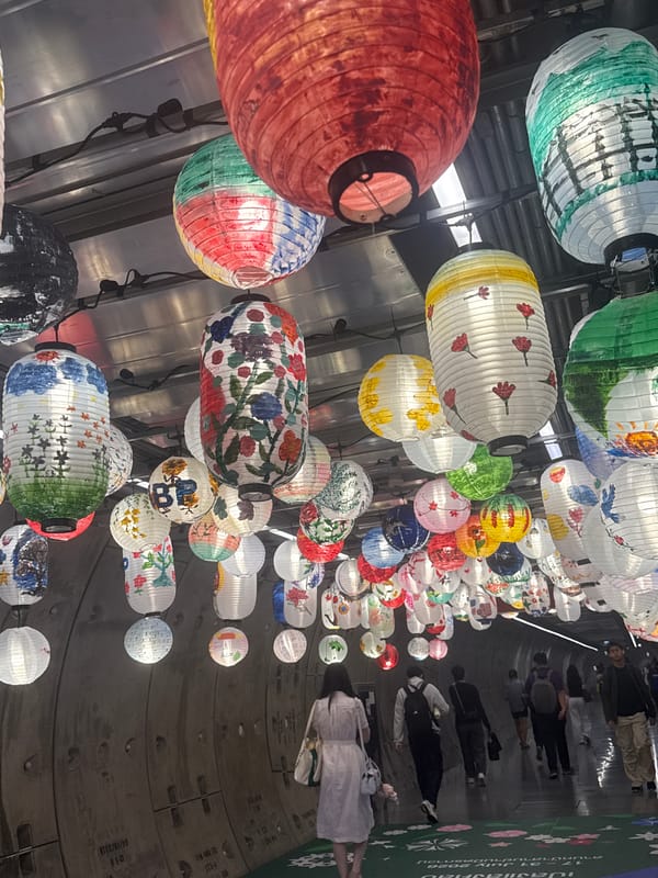 Colorful lantern installation lines Bangkok streets near Mahanakhon