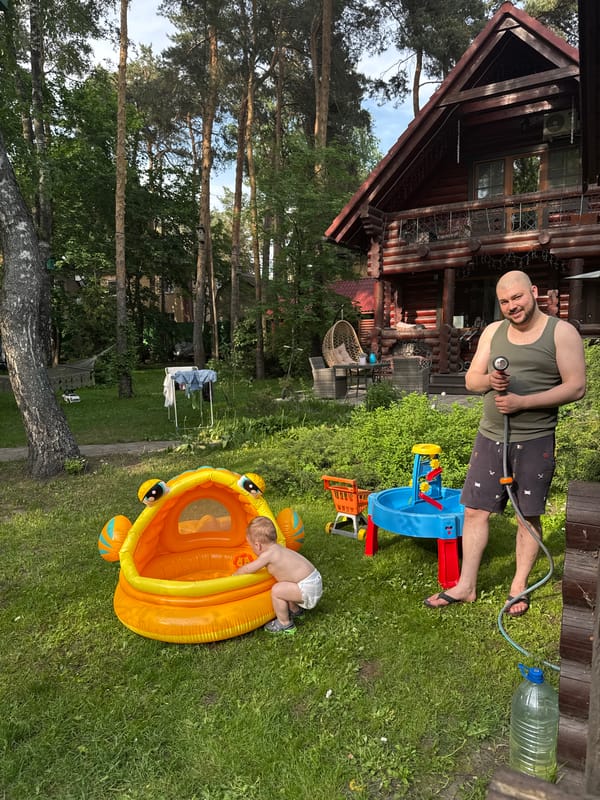 Family enjoys afternoon playtime in backyard pool in Tomilino
