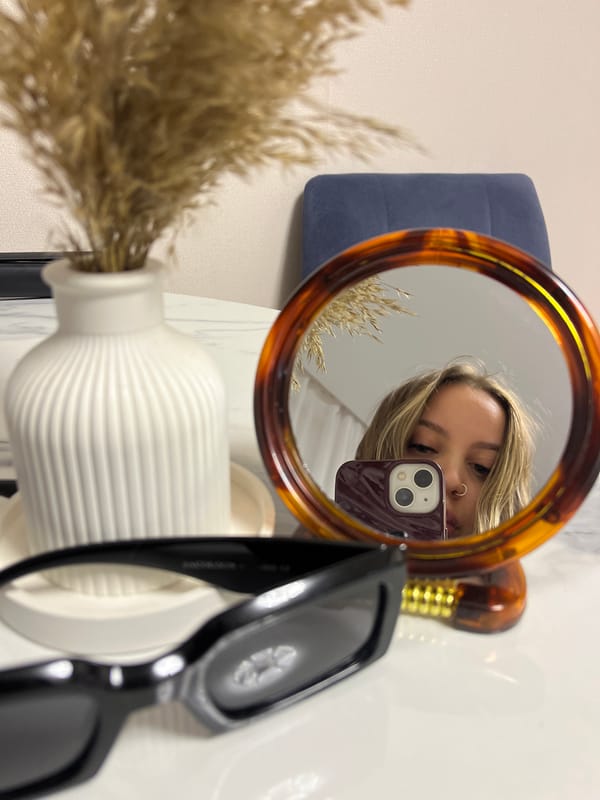 Person takes mirror selfies indoors in Krasnodar, Russia