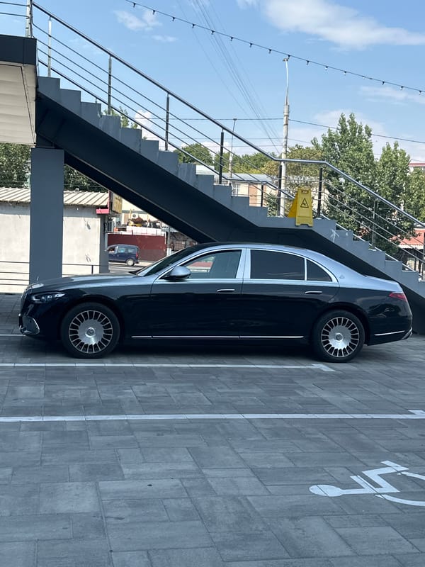 Inside a Chișinău BBQ store, plus a Maybach in the lot