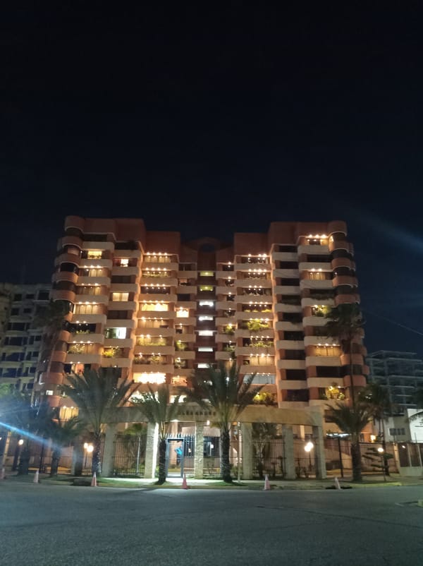 Nighttime coastal scenes documented across Porlamar, Venezuela waterfront district