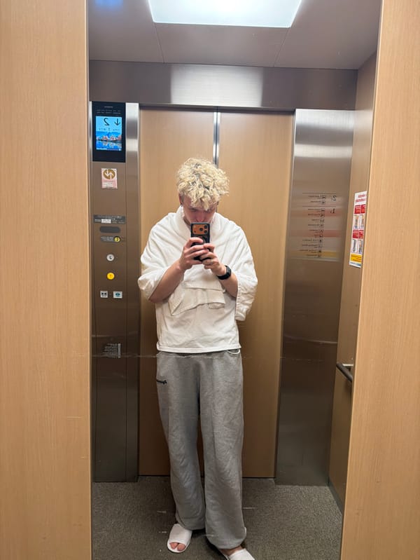 Visitor documents interior spaces at Kutchan building near ski resort