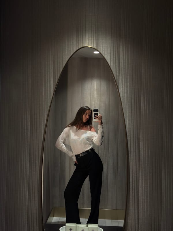 Woman takes mirror selfies in Budva Montenegro hotel
