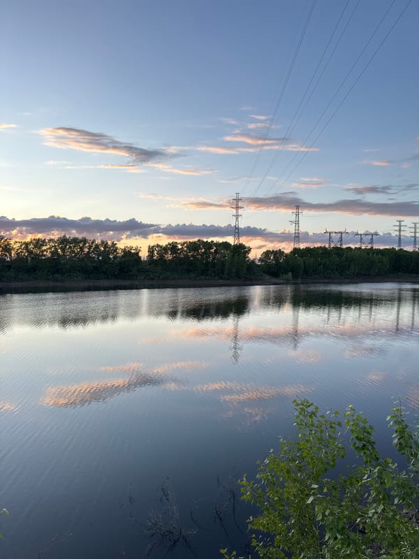 Sunset moments captured along Chaikovsky waterway, couple selfie included