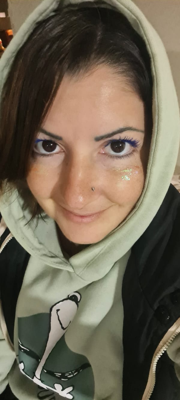 Person in green hoodie photographed in Nahariyya portrait session