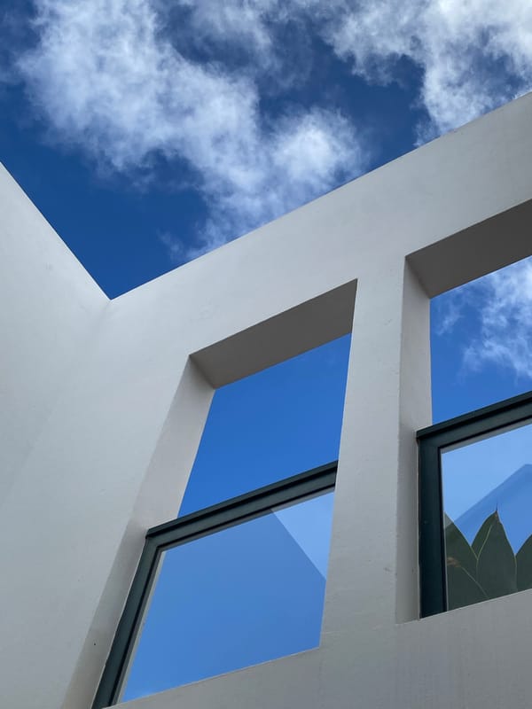 White concrete structure with window openings photographed in Yaiza