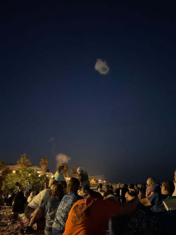 Full moon night gathering on the beach in Canet de Mar