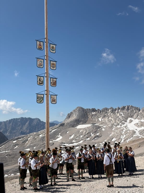 Brass band plays traditional Alpine set beneath Leutasch's mountain backdrop