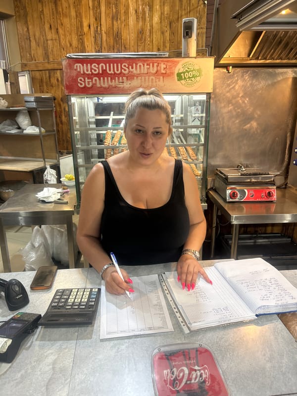 Inside a Yerevan shawarma shop, mid-afternoon.