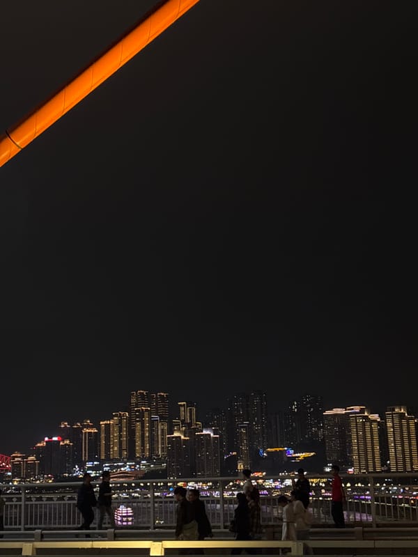 Nighttime cityscape observed from bridge in Yuzhong District