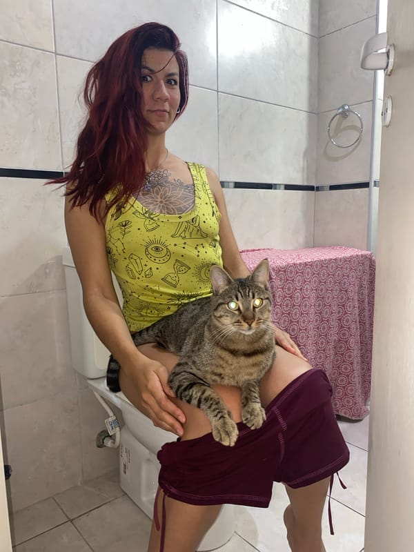 Woman and tabby cat share quiet moments in Wilde home