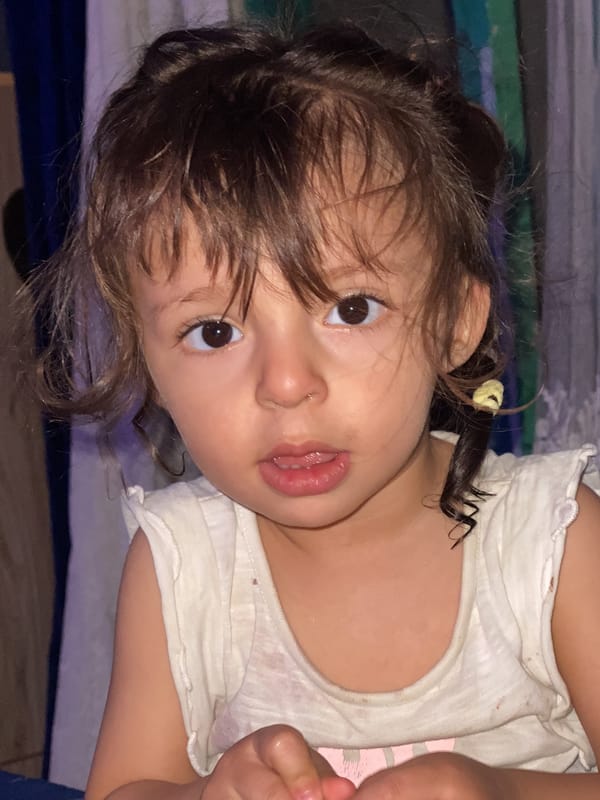 Child portrait photographed in Kandahar indoor setting