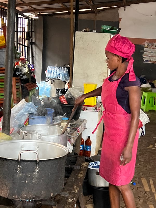 Communal outdoor cooking underway in Nkpor, Nigeria