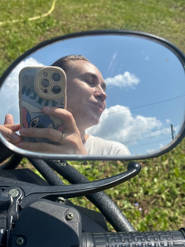 Sunny roadside stop with a motorcycle outside Ольховка