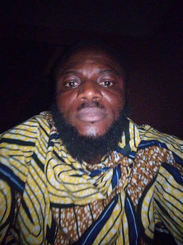 Man in colorful striped shirt photographed in Lokoja, Nigeria