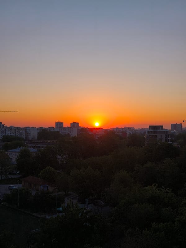 Sunset observed over Plovdiv, Bulgaria with silhouetted trees