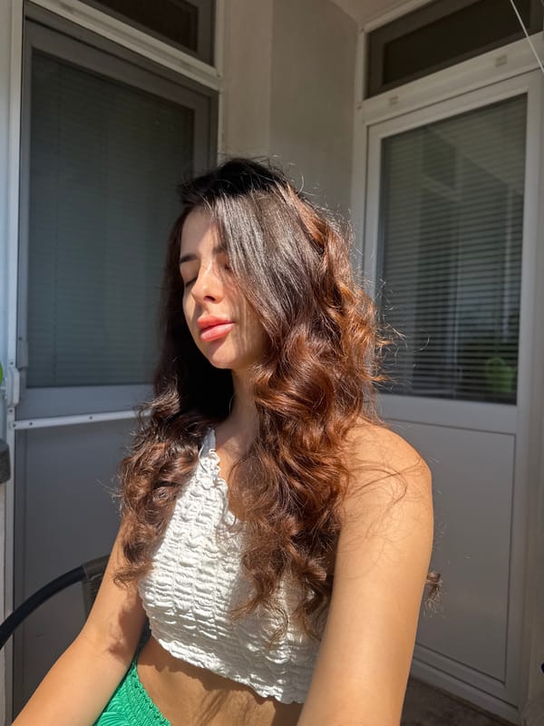 Sunny balcony session in Plovdiv, eyes closed, soaking it in