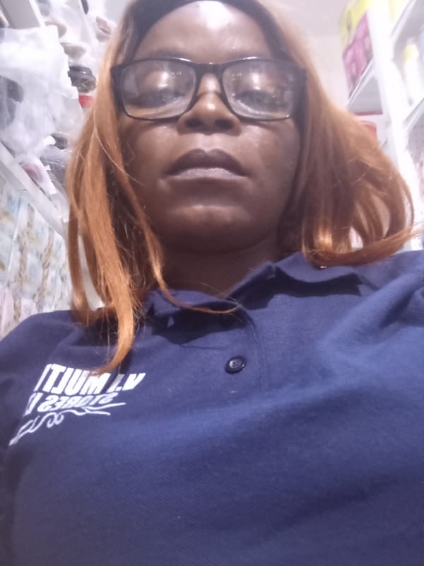 Retail worker selfie series inside a Nigerian store