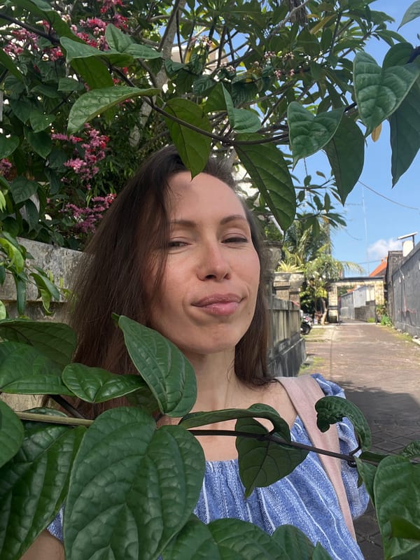 Woman takes morning selfie in North Kuta alleyway