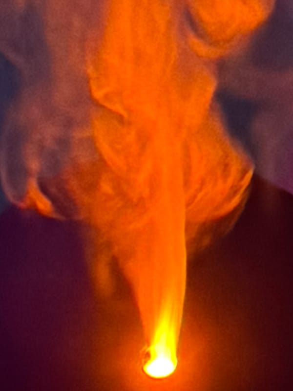 Candle flame illuminates snack table in Belgrade