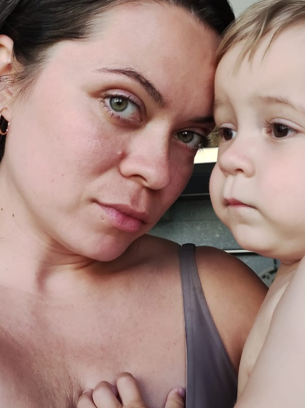 Woman and child photographed together indoors