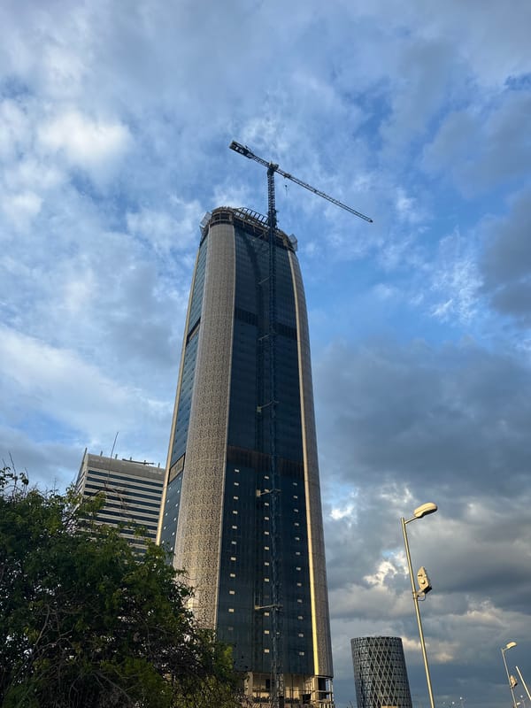 Glass skyscraper construction continues in Sofia with crane visible