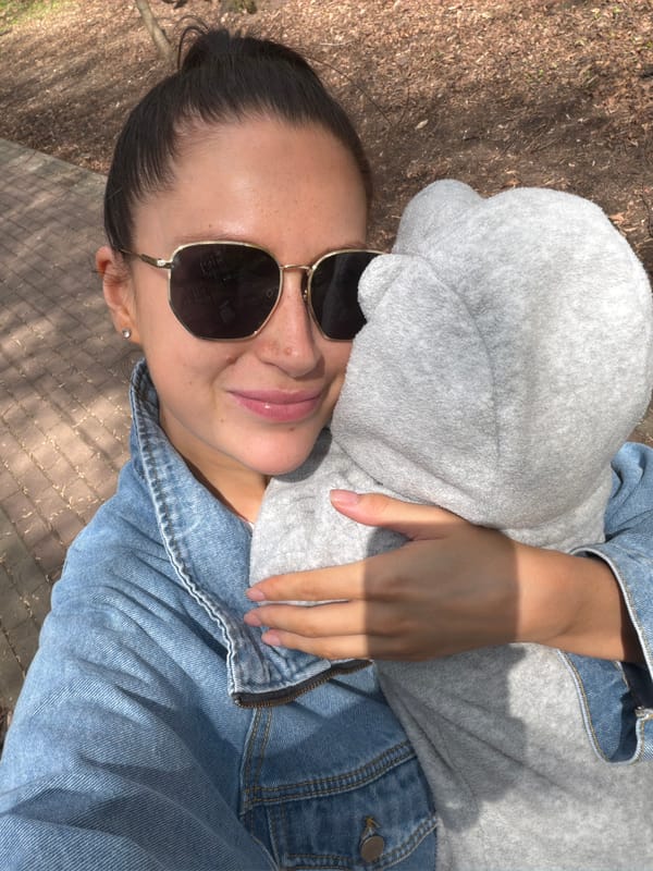 Woman with baby photographed on brick path in Khimki