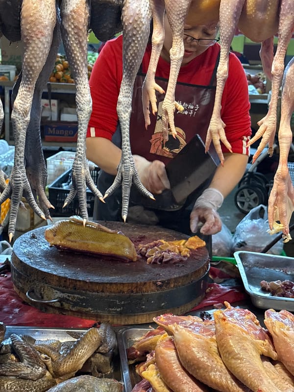 Early morning food market activity documented in Jiangjin, China