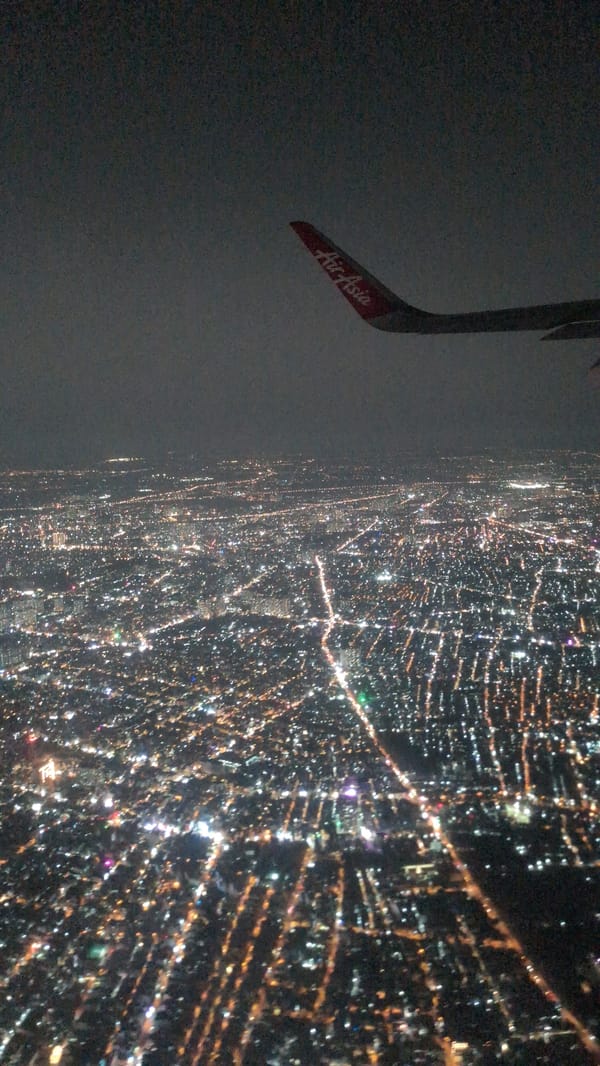 Aerial nighttime view of Ho Chi Minh City captured from airplane