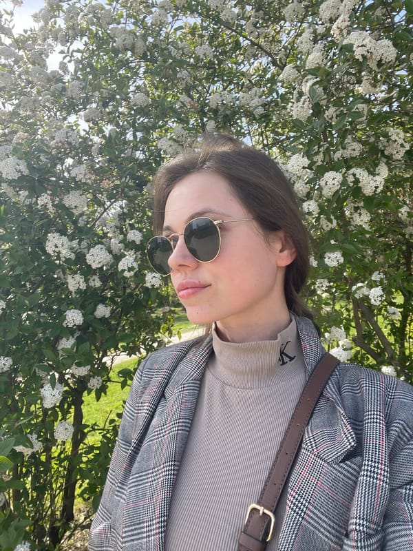 Woman enjoys spring photo session in blooming Ljubljana park