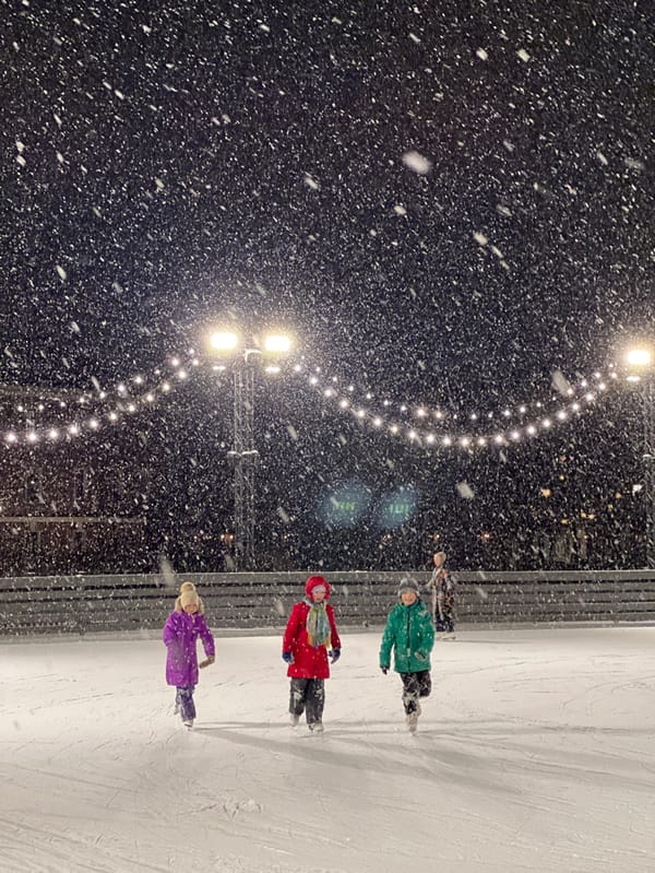 Families ice skate during heavy snowfall in Saint Petersburg