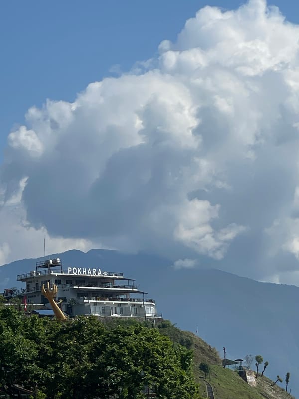 Elevated views of Phewa Lake and Pokhara documented from hillside