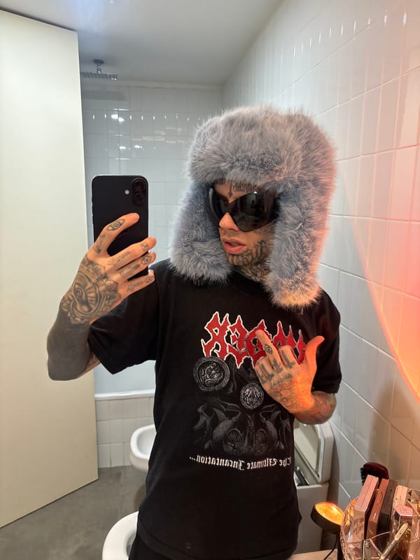 Tattooed individual photographed in Buenos Aires bathroom, bus departure recorded