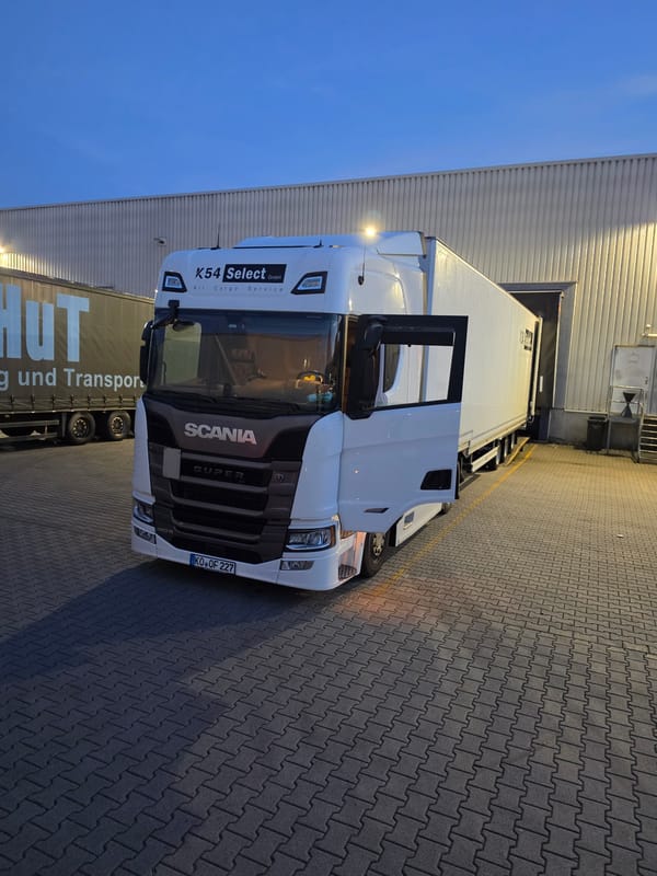 White Scania at a Zeppelinheim loading dock, late evening