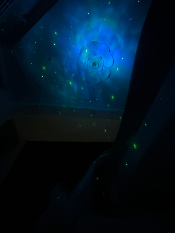 Colorful drum instrument captured overlooking nighttime Puttaparthi cityscape