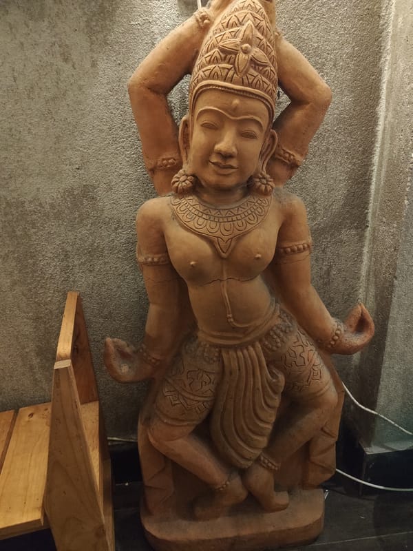 Statue and calico cat spotted in Da Lat