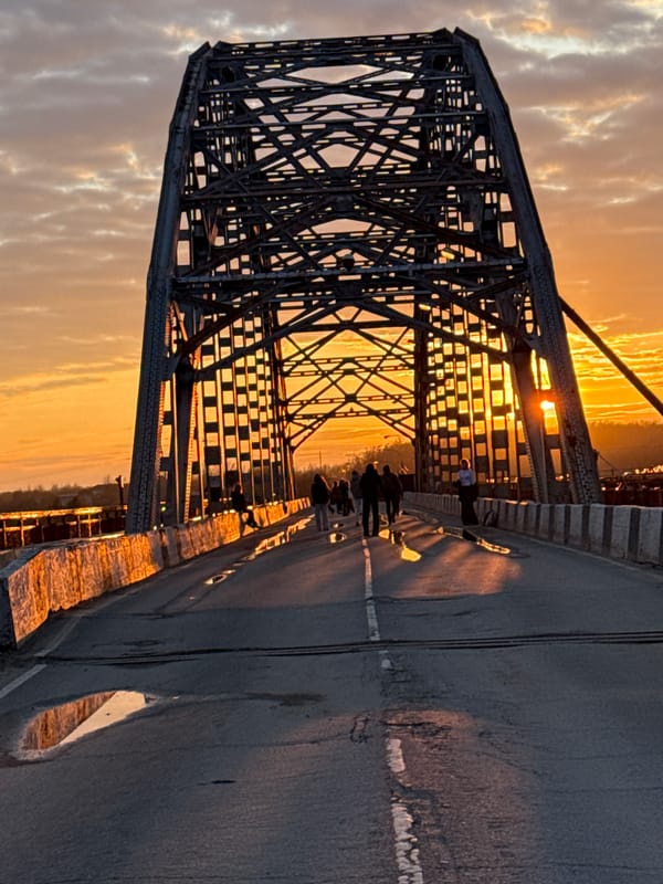 Golden hour bridge photography session captured in Dmitrov, Russia