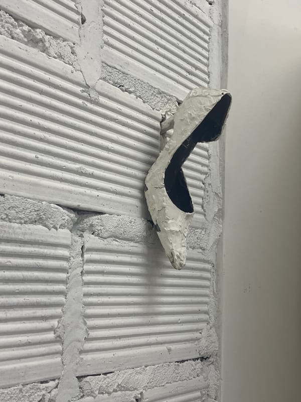 Objects observed against white brick surfaces in Buenos Aires