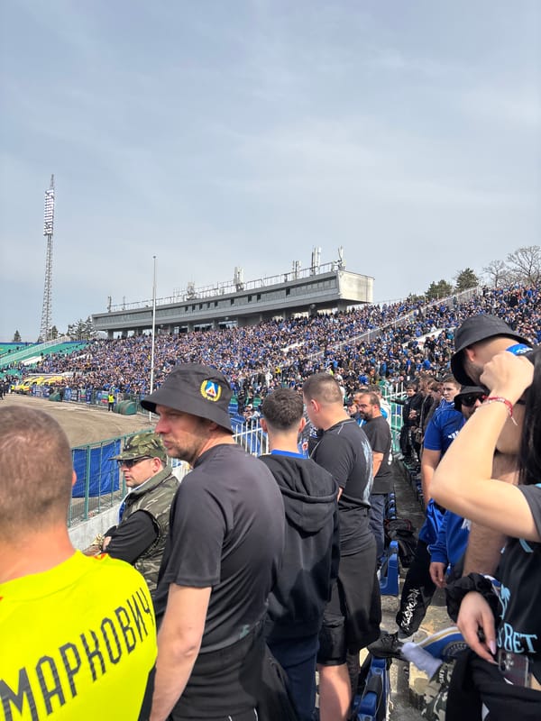 Packed stadium draws blue-clad crowds in unknown location