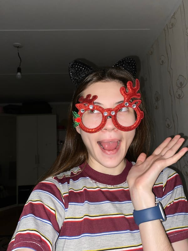 Young person takes playful selfies with novelty accessories in Votkinsk