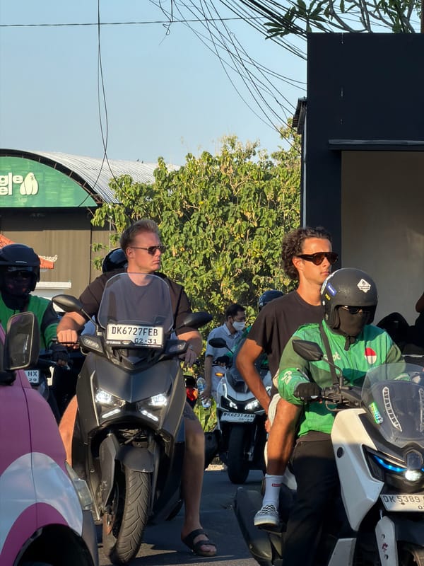 Morning scooter traffic flows through North Kuta streets
